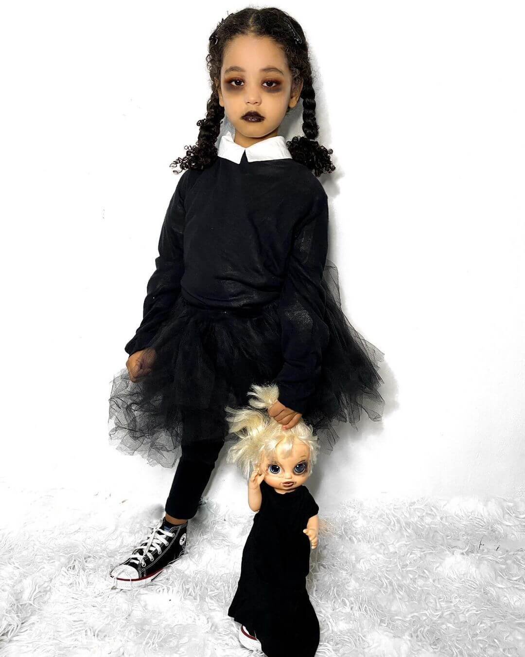 Black dress with long neatly combed hair will make scary Halloween costumes for kids