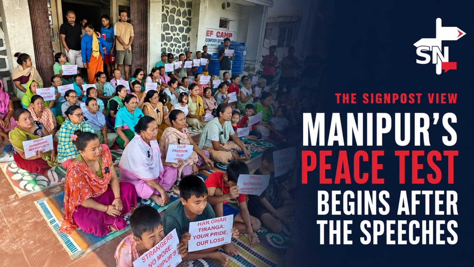Internally displaced people at a Manipur relief camp hold protest placards during an Independence Day protest in Manipur.